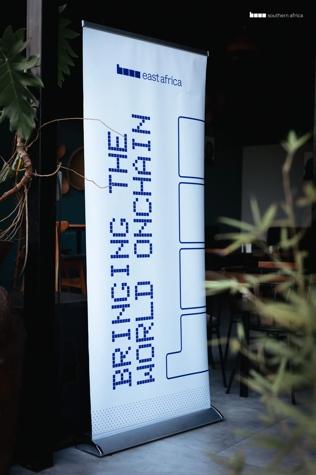 Base east africa roll-up banner reading “Bringing the world onchain”